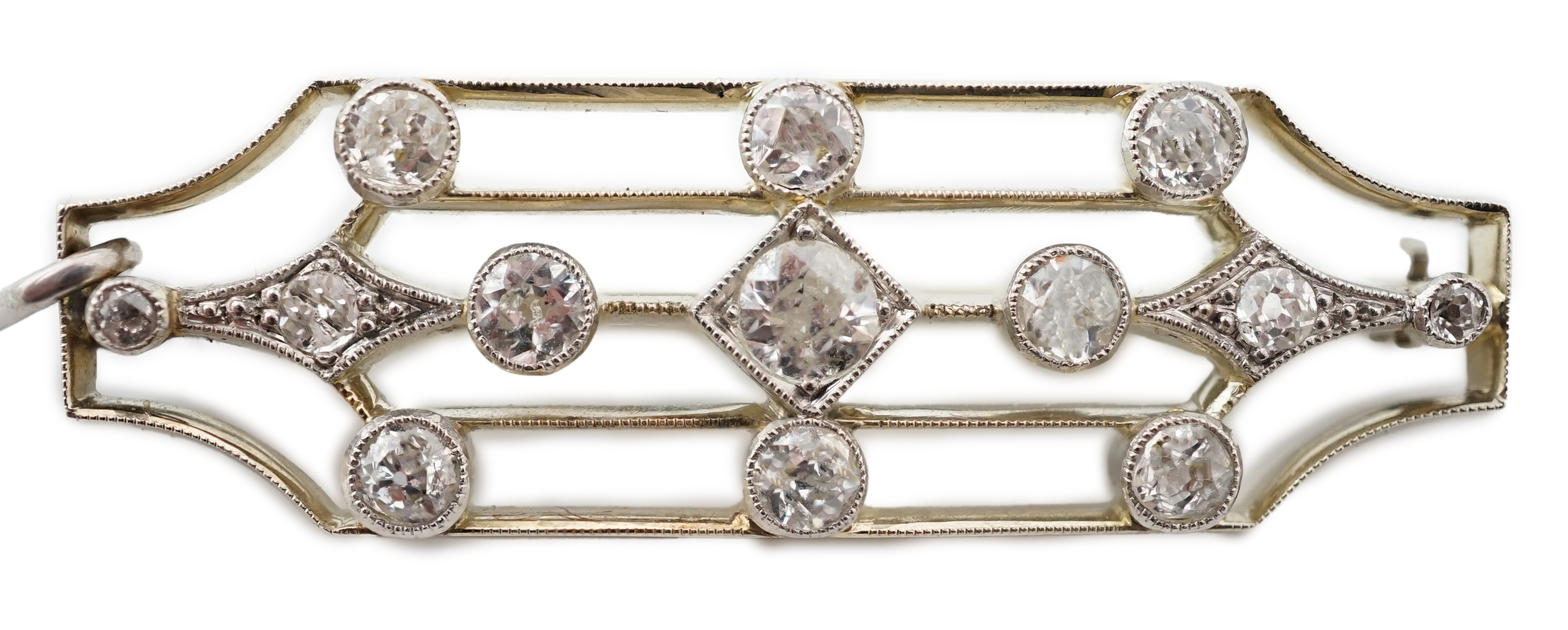 An early 20th century 18ct white gold, platinum and millegrain set diamond cluster openwork brooch